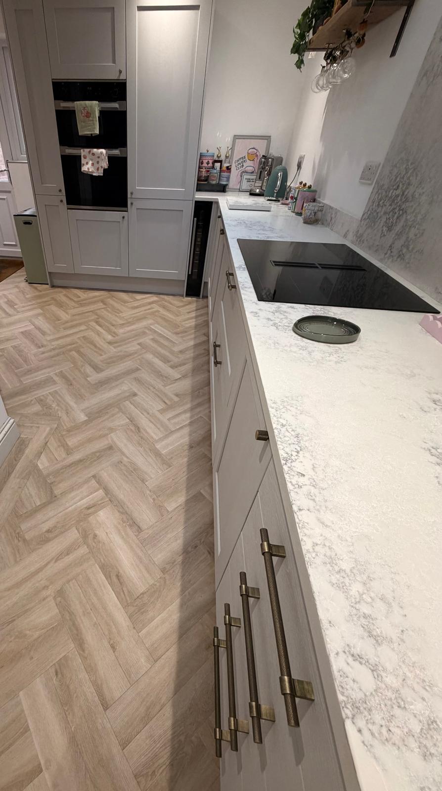 Herringbone LVT through a working family kitchen