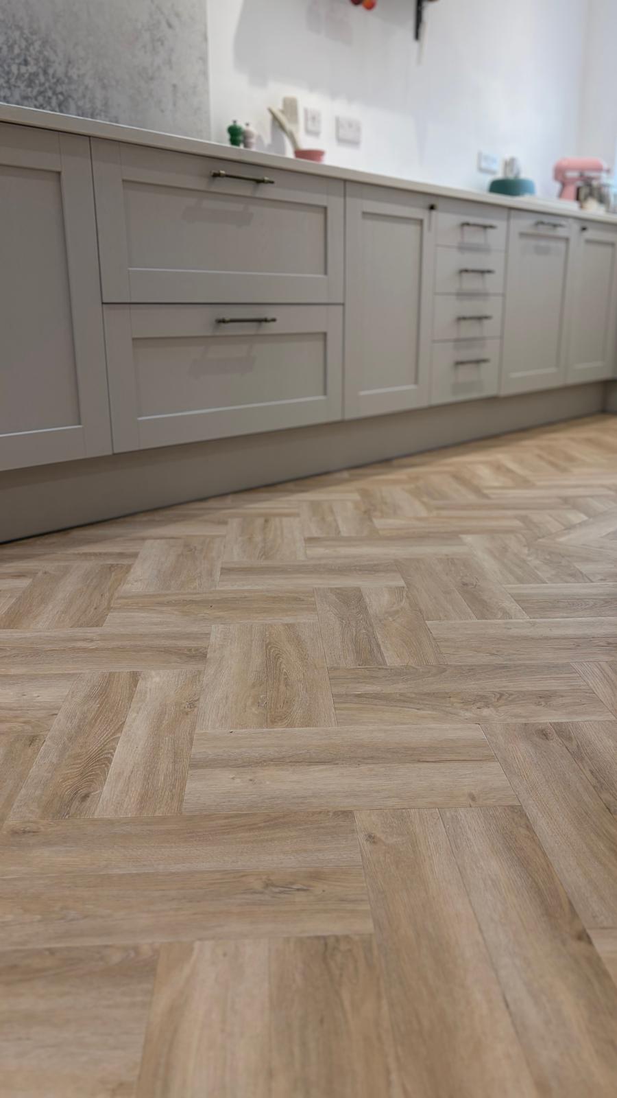 Close view across the herringbone LVT pattern